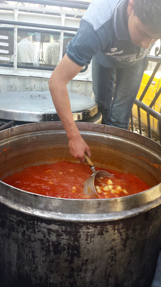 While also receiving food assistance from international NGOs and the Syrian government, Palestinians in refugee camps have now created locally-formed committees to provide daily nourishment for the influx of displaced persons.