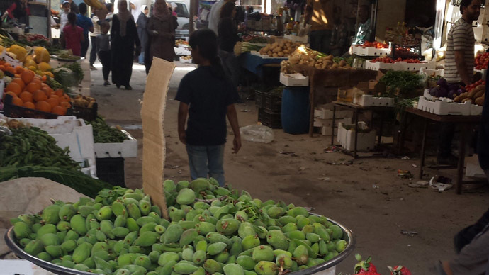 A food market inside Jeramana, one of 14 official and unofficial Palestinian refugee camps inside Syria.