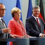 German Chancellor Merkel, French President Hollande and Ukrainian President Poroshenko speak to media after their meeting in the Chancellery in Berlin