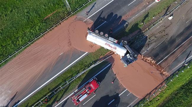 Liquid chocolate spill from truck accident leaves Polish highway a sticky mess