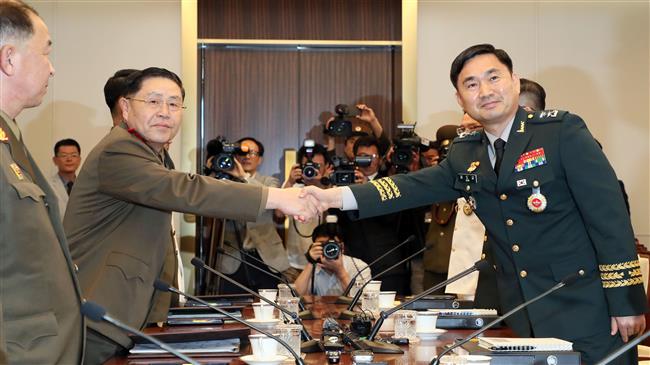 Two Koreas work toward easing border tension