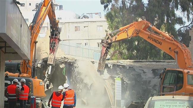 Israel demolishes shops at refugee camp in occupied al-Quds