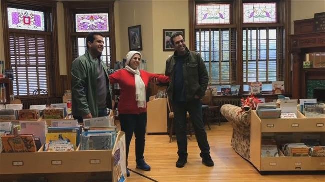 Separated by Trump’s travel ban, Iranian families reunite at border library