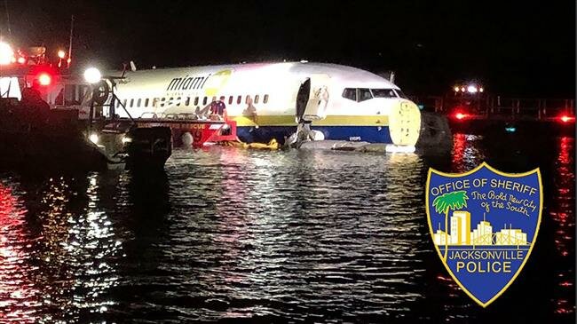Boeing 737 slides off runway into Florida river, 21 hurt