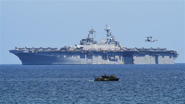 Beijing warns off US warships in disputed South China Sea